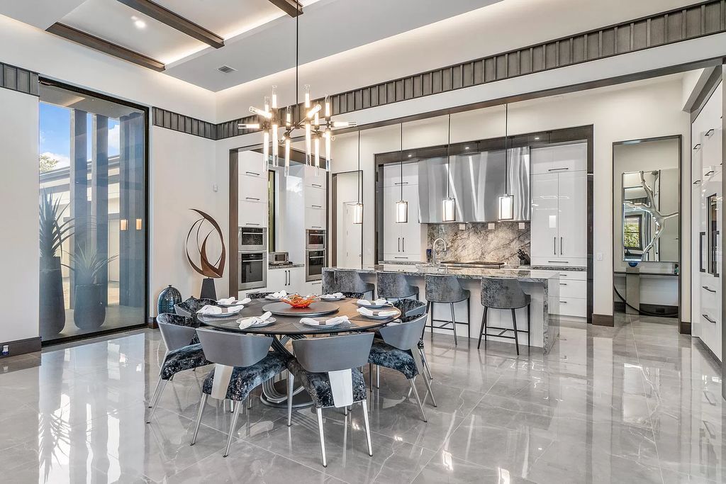The Home in Delray Beach is a striking custom-built estate with the grand open concept, luxury finishes and modern architectural millwork now available for sale. This home located at 5526 Vintage Oaks Ter, Delray Beach, Florida