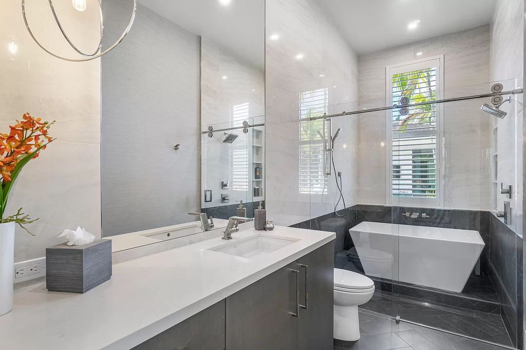 The Home in Delray Beach is a striking custom-built estate with the grand open concept, luxury finishes and modern architectural millwork now available for sale. This home located at 5526 Vintage Oaks Ter, Delray Beach, Florida