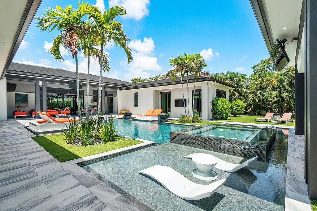 The Home in Delray Beach is a striking custom-built estate with the grand open concept, luxury finishes and modern architectural millwork now available for sale. This home located at 5526 Vintage Oaks Ter, Delray Beach, Florida
