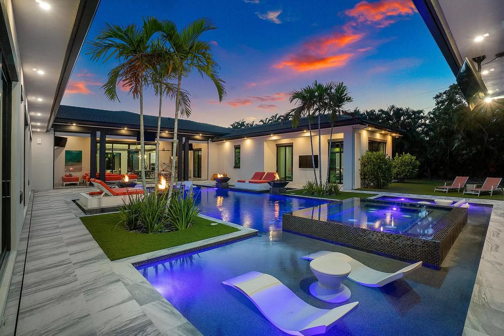The Home in Delray Beach is a striking custom-built estate with the grand open concept, luxury finishes and modern architectural millwork now available for sale. This home located at 5526 Vintage Oaks Ter, Delray Beach, Florida