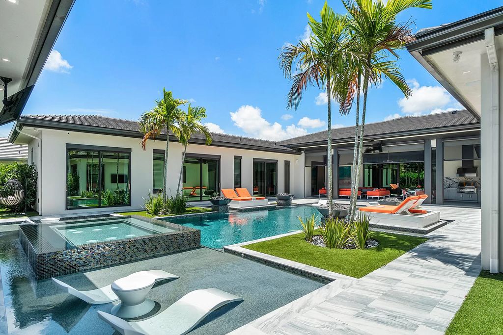 The Home in Delray Beach is a striking custom-built estate with the grand open concept, luxury finishes and modern architectural millwork now available for sale. This home located at 5526 Vintage Oaks Ter, Delray Beach, Florida