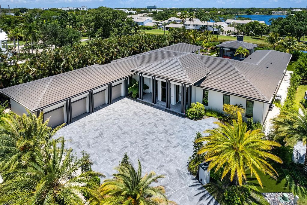 The Home in Delray Beach is a striking custom-built estate with the grand open concept, luxury finishes and modern architectural millwork now available for sale. This home located at 5526 Vintage Oaks Ter, Delray Beach, Florida