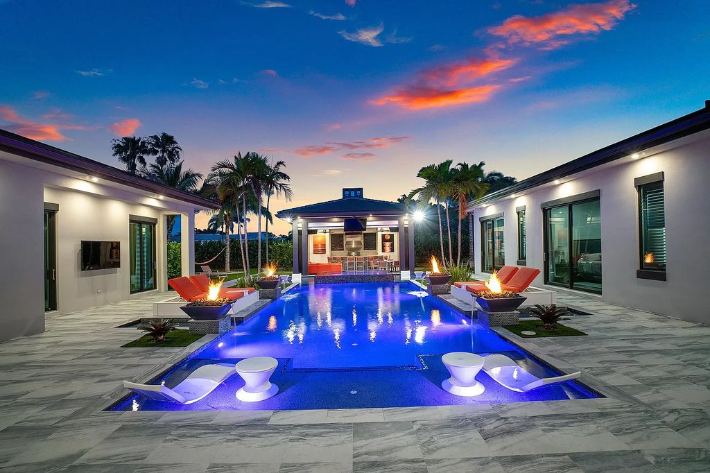 The Home in Delray Beach is a striking custom-built estate with the grand open concept, luxury finishes and modern architectural millwork now available for sale. This home located at 5526 Vintage Oaks Ter, Delray Beach, Florida