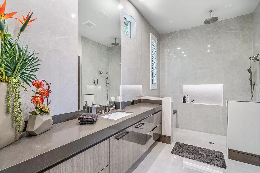 The Home in Delray Beach is a striking custom-built estate with the grand open concept, luxury finishes and modern architectural millwork now available for sale. This home located at 5526 Vintage Oaks Ter, Delray Beach, Florida