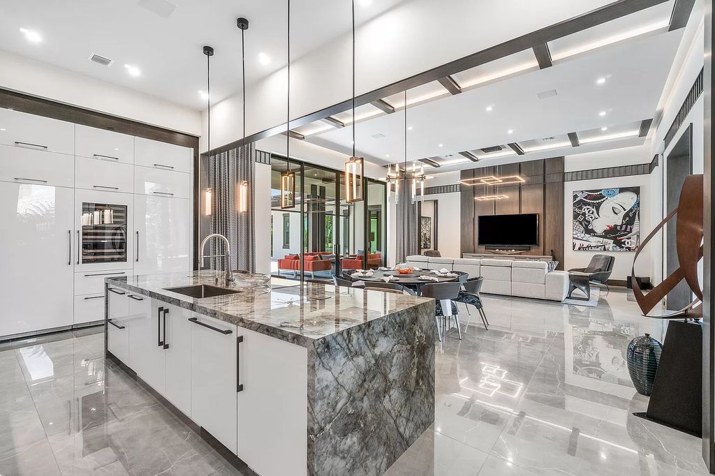 The Home in Delray Beach is a striking custom-built estate with the grand open concept, luxury finishes and modern architectural millwork now available for sale. This home located at 5526 Vintage Oaks Ter, Delray Beach, Florida