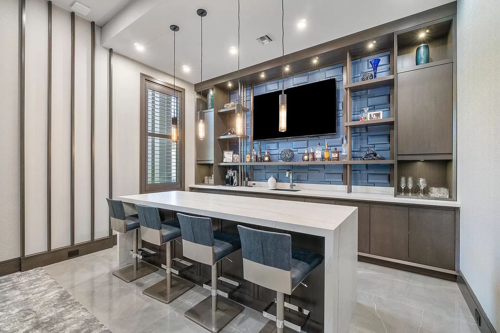 The Home in Delray Beach is a striking custom-built estate with the grand open concept, luxury finishes and modern architectural millwork now available for sale. This home located at 5526 Vintage Oaks Ter, Delray Beach, Florida