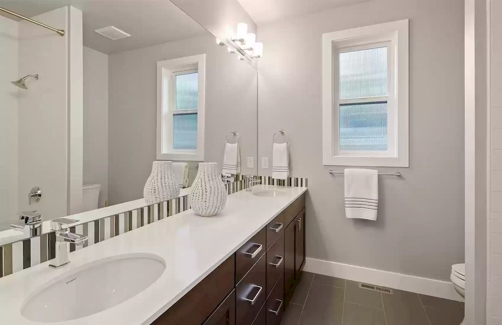 The House in Bellevue is covered outdoor living perfect for year-round enjoyment, now available for sale. This home located at 10803 SE 25th Place, Bellevue, Washington