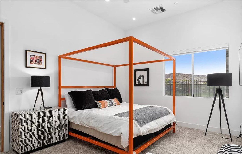 If you are bored by the frequent appearance of neutral, monochrome tones and tend to be maximalism style, do not hesitate to use vibrant and striking tones. As in the above luxury Ideas, the white tone room has been lightened up and more eye-catching with a canopy bed having an orange-red frame and geometric nightstand. With this neutral backdrop, you can easily incorporate a wide range of colorful tones for your canopy bed to enhance the style and ambiance of your home.