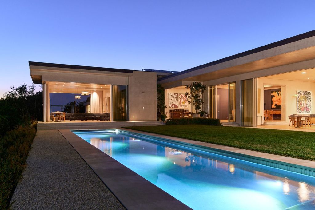 The Mansion in Los Angeles is a contemporary masterpiece with impressive views, inspired design, and a serenely secluded location with gated access now available for sale. This home located at 335 Trousdale Pl, Beverly Hills, California