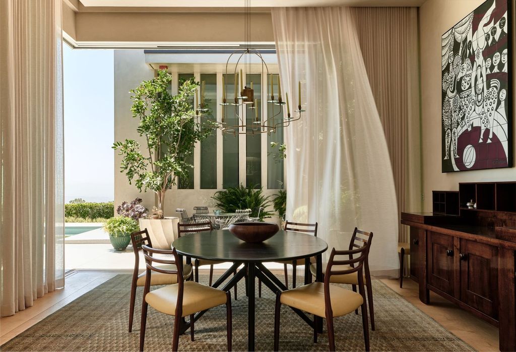 The Mansion in Los Angeles is a contemporary masterpiece with impressive views, inspired design, and a serenely secluded location with gated access now available for sale. This home located at 335 Trousdale Pl, Beverly Hills, California