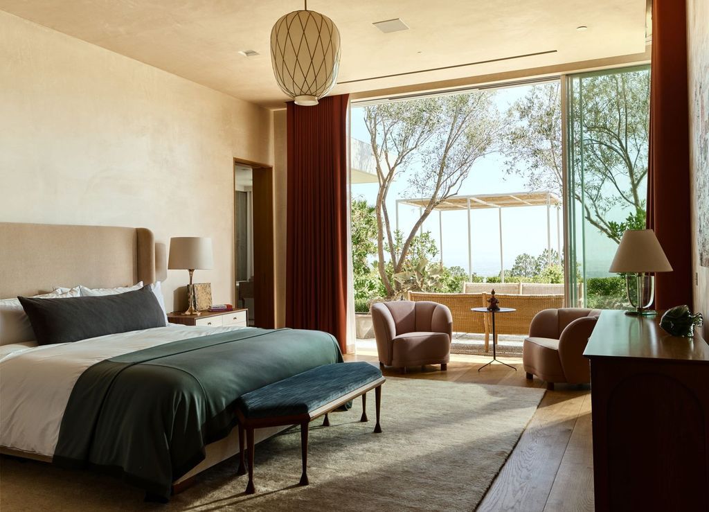 The Mansion in Los Angeles is a contemporary masterpiece with impressive views, inspired design, and a serenely secluded location with gated access now available for sale. This home located at 335 Trousdale Pl, Beverly Hills, California