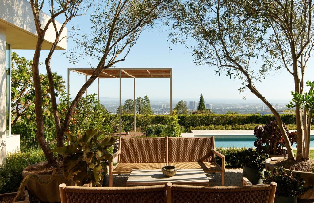 The Mansion in Los Angeles is a contemporary masterpiece with impressive views, inspired design, and a serenely secluded location with gated access now available for sale. This home located at 335 Trousdale Pl, Beverly Hills, California