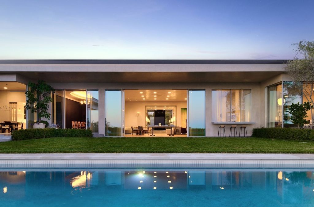 The Mansion in Los Angeles is a contemporary masterpiece with impressive views, inspired design, and a serenely secluded location with gated access now available for sale. This home located at 335 Trousdale Pl, Beverly Hills, California
