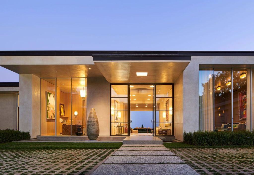 The Mansion in Los Angeles is a contemporary masterpiece with impressive views, inspired design, and a serenely secluded location with gated access now available for sale. This home located at 335 Trousdale Pl, Beverly Hills, California
