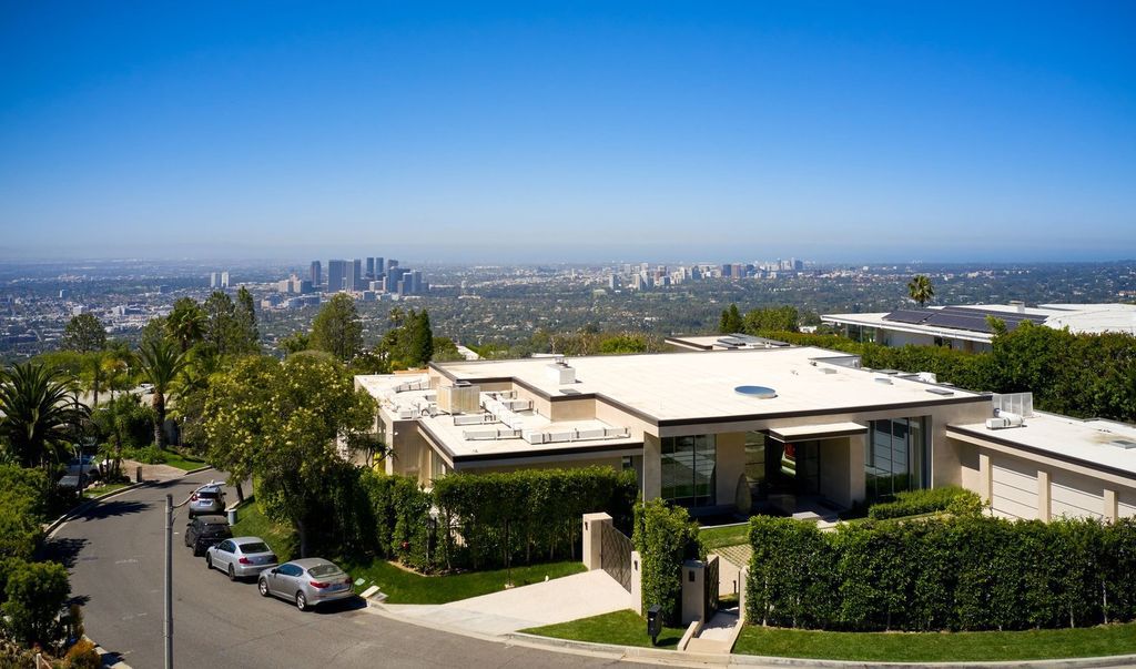 The Mansion in Los Angeles is a contemporary masterpiece with impressive views, inspired design, and a serenely secluded location with gated access now available for sale. This home located at 335 Trousdale Pl, Beverly Hills, California
