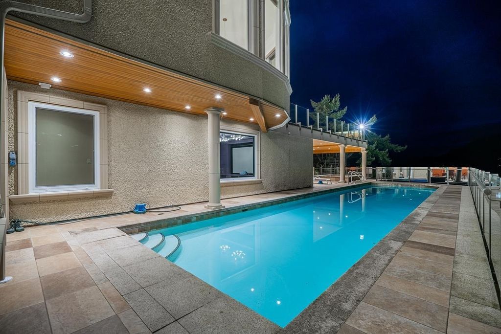 The Estate in West Vancouver is a luxurious home with stunning ocean views, now available for sale. This home located at 6935 Isleview Rd, West Vancouver, BC V7W 2L1, Canada