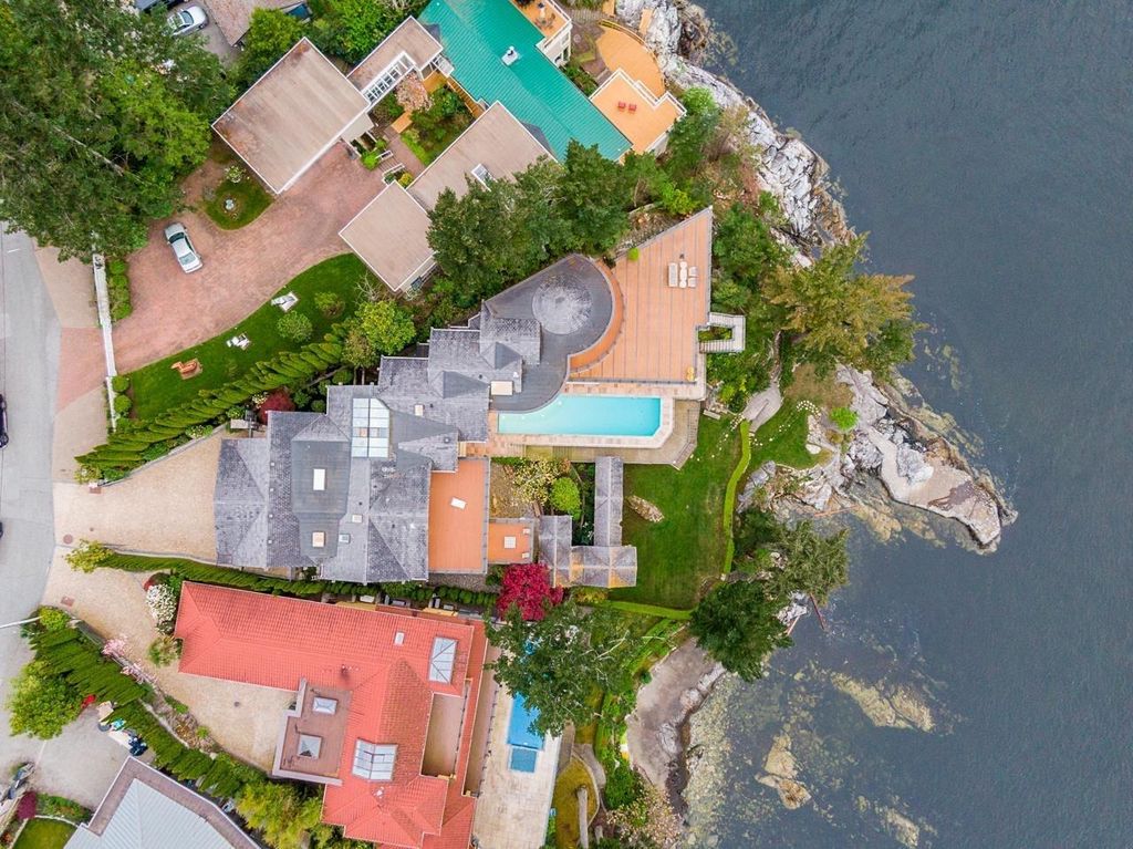 The Estate in West Vancouver is a luxurious home with stunning ocean views, now available for sale. This home located at 6935 Isleview Rd, West Vancouver, BC V7W 2L1, Canada