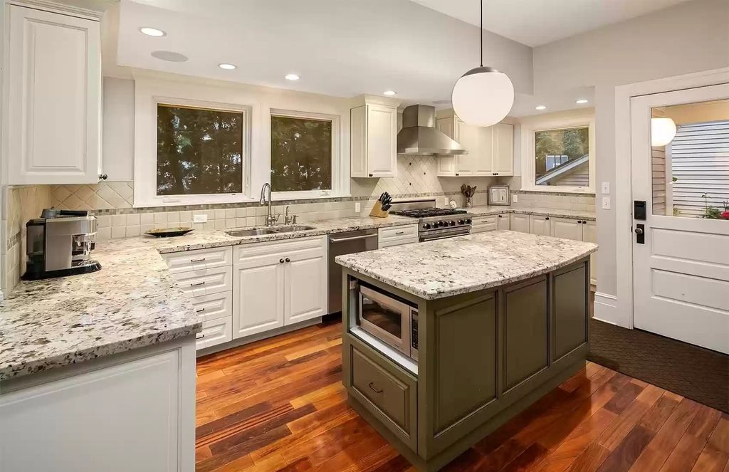 The Estate in Washington is a luxurious home surrounded by lush greenery and majestic trees now available for sale. This home located at 3816 E Garfield Street, Seattle, Washington; offering 06 bedrooms and 05 bathrooms with 5,328 square feet of living spaces.