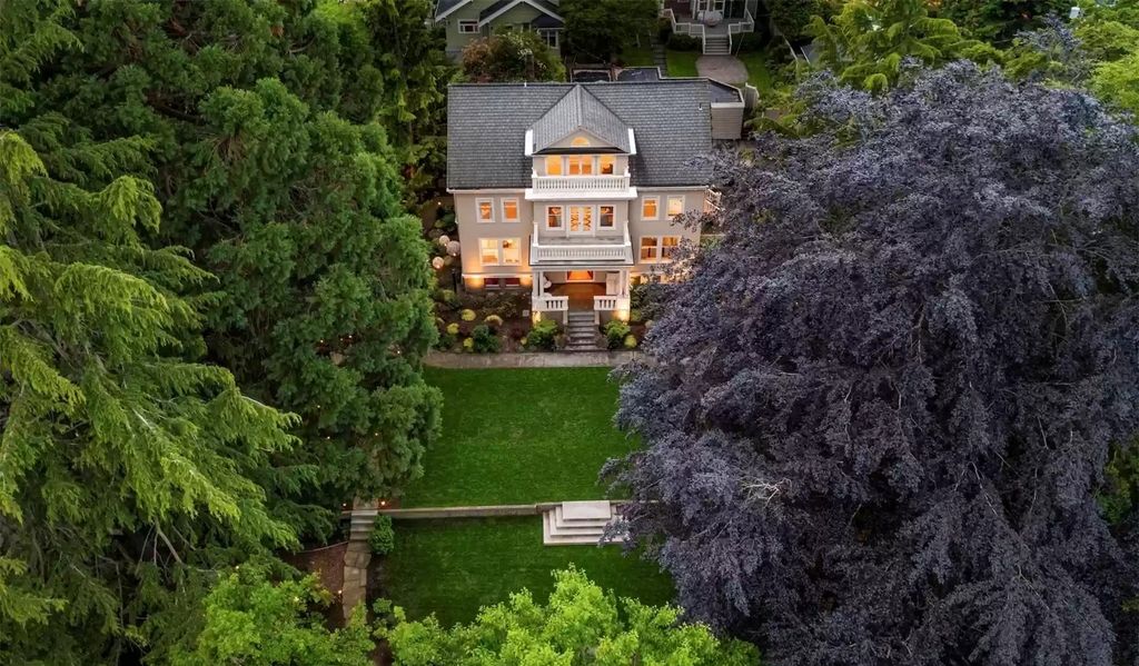 The Estate in Washington is a luxurious home surrounded by lush greenery and majestic trees now available for sale. This home located at 3816 E Garfield Street, Seattle, Washington; offering 06 bedrooms and 05 bathrooms with 5,328 square feet of living spaces.