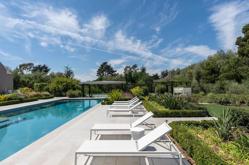 The Home in Santa Barbara is a stunning modern estate with newly constructed pool and spa, tennis court wit pavilion, vegetable gardens, firepit, stunning mountain, ocean and golf-course views now available for sale. This home located at 1850 Jelinda Dr, Santa Barbara, California