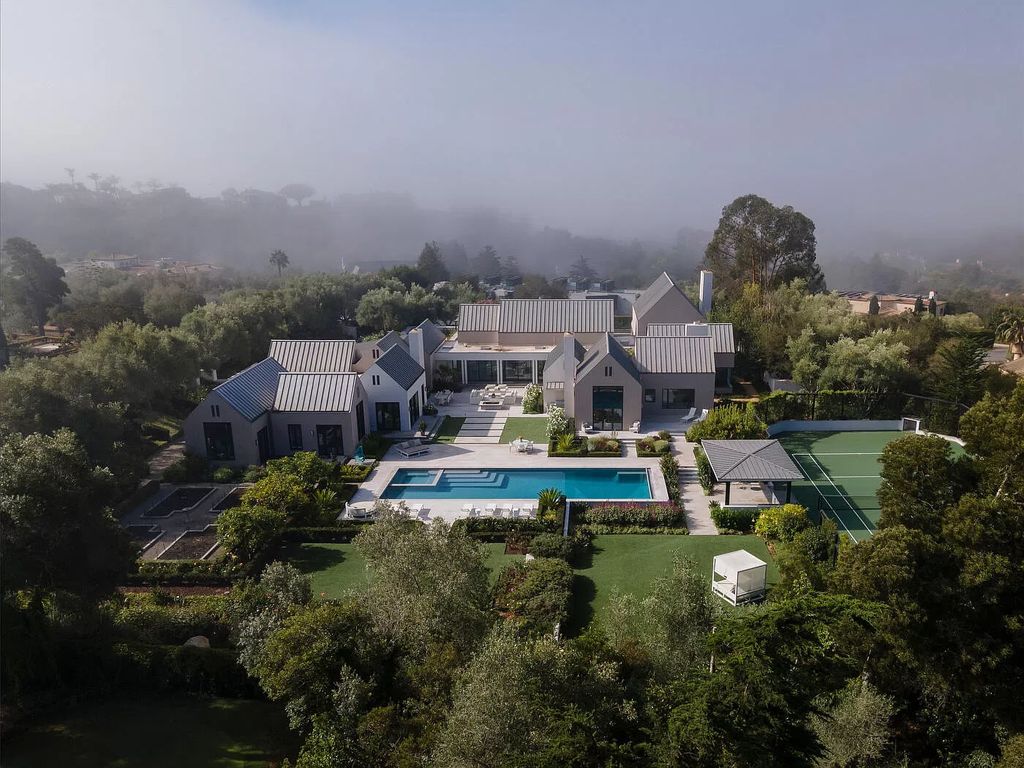 The Home in Santa Barbara is a stunning modern estate with newly constructed pool and spa, tennis court wit pavilion, vegetable gardens, firepit, stunning mountain, ocean and golf-course views now available for sale. This home located at 1850 Jelinda Dr, Santa Barbara, California