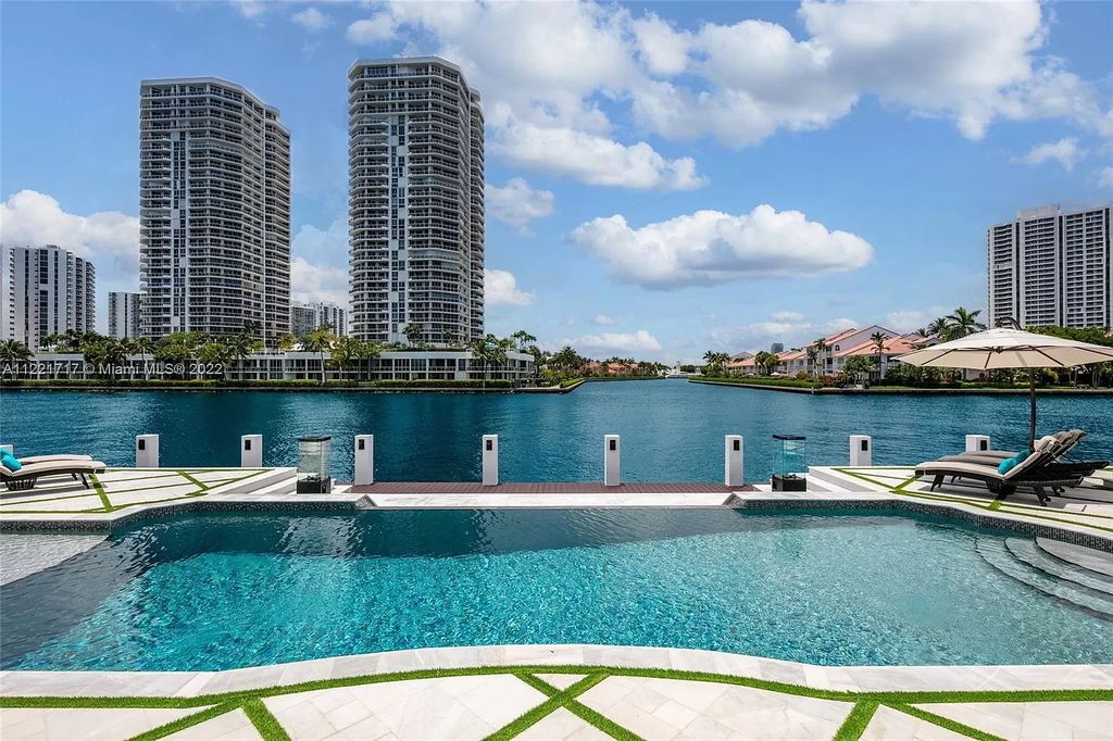 The Home in Golden Beach is an ultra-lavish waterfront palatial estate is set behind private gates at the end of a cul de sac now available for sale. This home located at 498 North Pkwy, Golden Beach, Florida