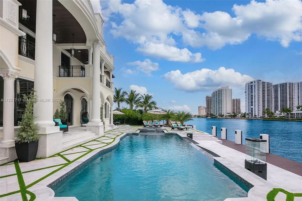 The Home in Golden Beach is an ultra-lavish waterfront palatial estate is set behind private gates at the end of a cul de sac now available for sale. This home located at 498 North Pkwy, Golden Beach, Florida