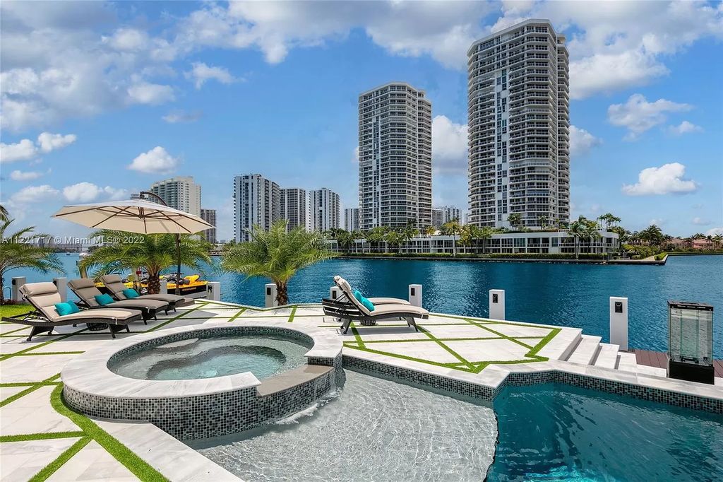 The Home in Golden Beach is an ultra-lavish waterfront palatial estate is set behind private gates at the end of a cul de sac now available for sale. This home located at 498 North Pkwy, Golden Beach, Florida