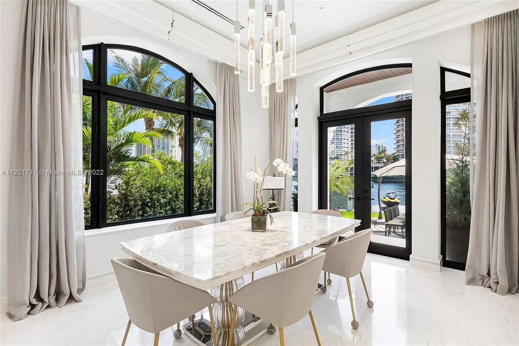 The Home in Golden Beach is an ultra-lavish waterfront palatial estate is set behind private gates at the end of a cul de sac now available for sale. This home located at 498 North Pkwy, Golden Beach, Florida