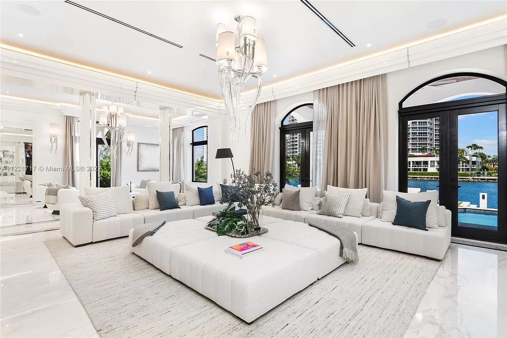 The Home in Golden Beach is an ultra-lavish waterfront palatial estate is set behind private gates at the end of a cul de sac now available for sale. This home located at 498 North Pkwy, Golden Beach, Florida