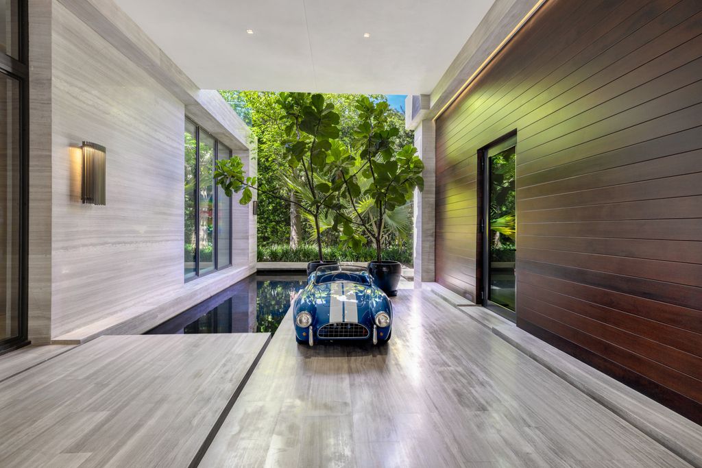 The Mansion in Miami Beach is a luxurious retreat-inspired custom built residence provides a zen ambiance with floating orchid gardens now available for sale. This home located at 4395 Pine Tree Dr, Miami Beach, Florida