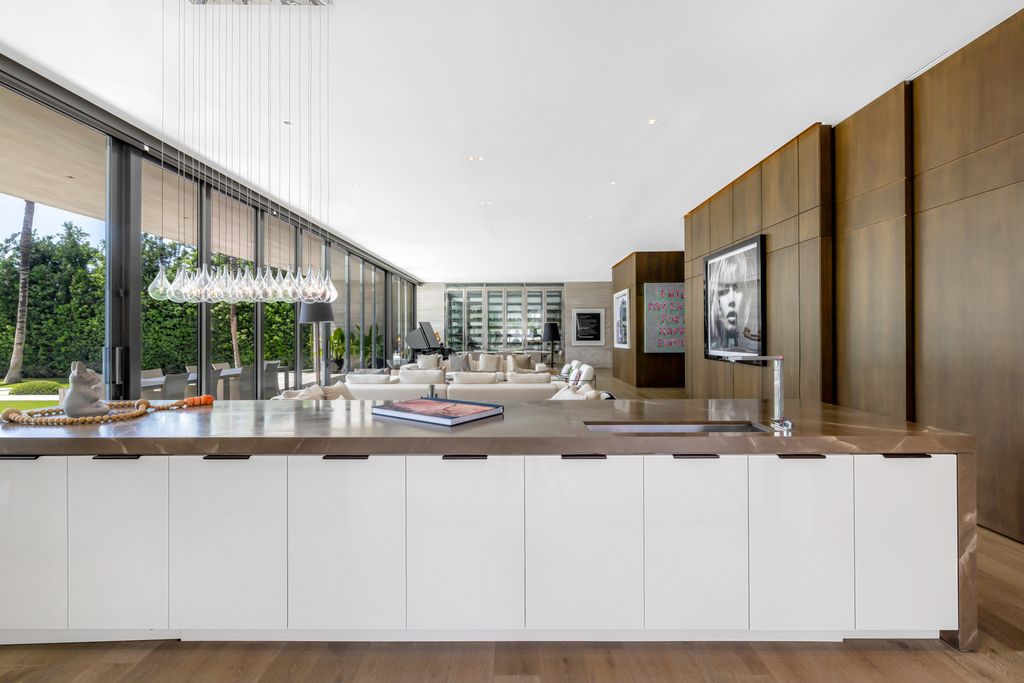 The Mansion in Miami Beach is a luxurious retreat-inspired custom built residence provides a zen ambiance with floating orchid gardens now available for sale. This home located at 4395 Pine Tree Dr, Miami Beach, Florida