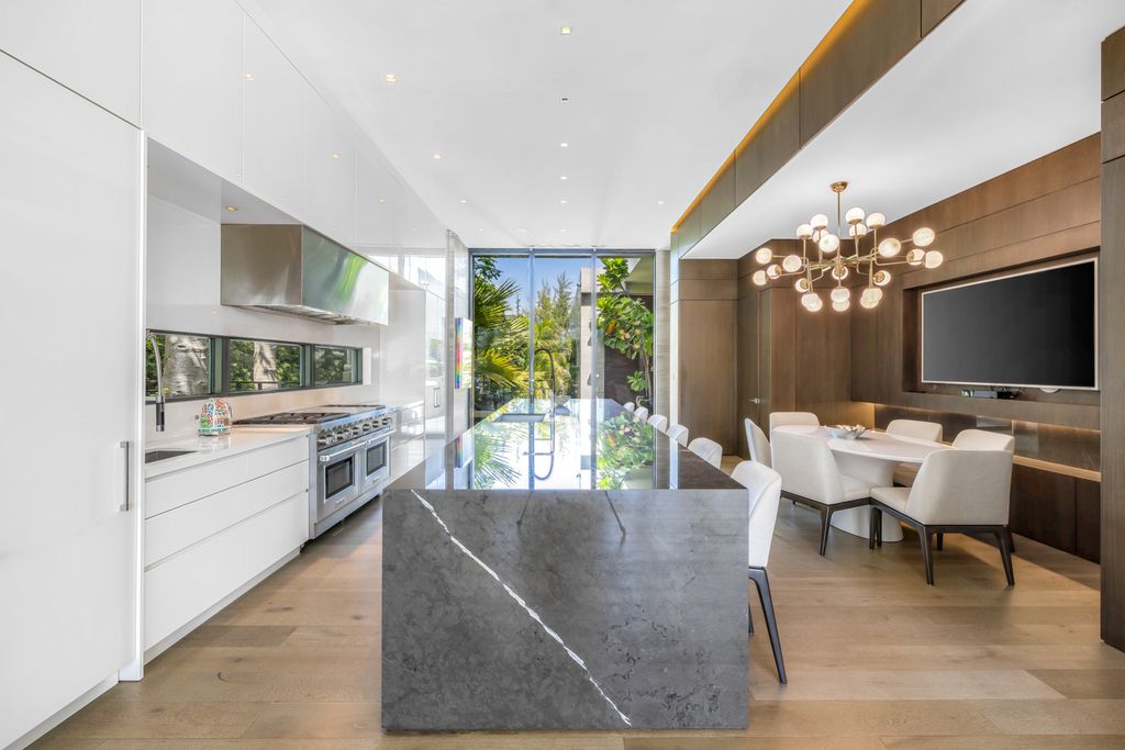 The Mansion in Miami Beach is a luxurious retreat-inspired custom built residence provides a zen ambiance with floating orchid gardens now available for sale. This home located at 4395 Pine Tree Dr, Miami Beach, Florida
