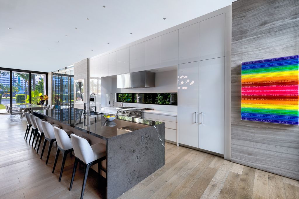 The Mansion in Miami Beach is a luxurious retreat-inspired custom built residence provides a zen ambiance with floating orchid gardens now available for sale. This home located at 4395 Pine Tree Dr, Miami Beach, Florida