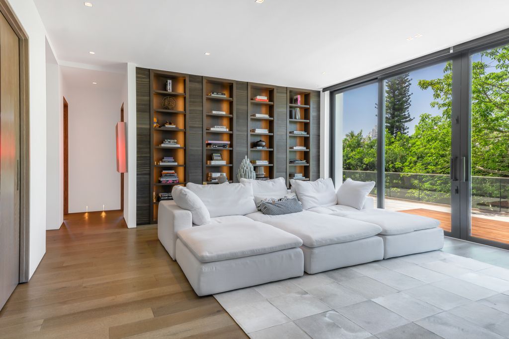 The Mansion in Miami Beach is a luxurious retreat-inspired custom built residence provides a zen ambiance with floating orchid gardens now available for sale. This home located at 4395 Pine Tree Dr, Miami Beach, Florida