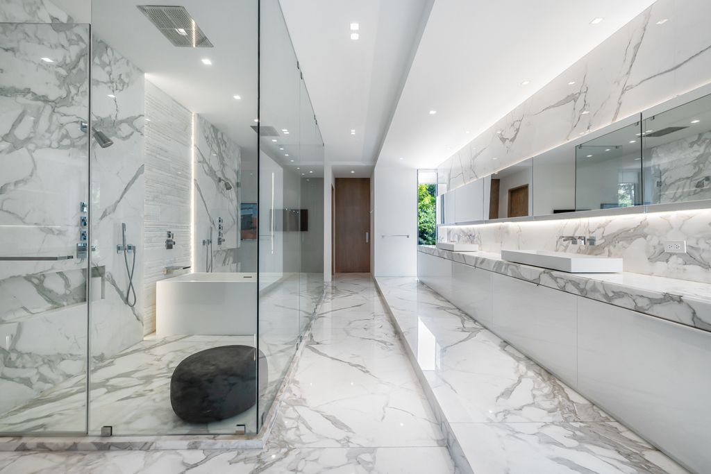 The Mansion in Miami Beach is a luxurious retreat-inspired custom built residence provides a zen ambiance with floating orchid gardens now available for sale. This home located at 4395 Pine Tree Dr, Miami Beach, Florida