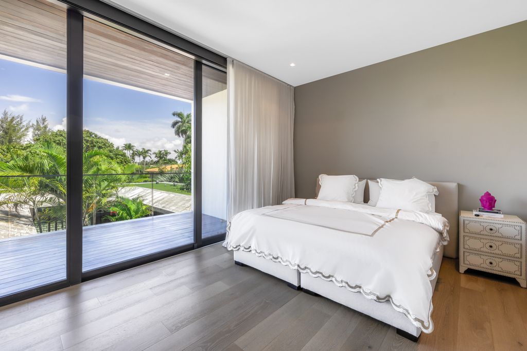 The Mansion in Miami Beach is a luxurious retreat-inspired custom built residence provides a zen ambiance with floating orchid gardens now available for sale. This home located at 4395 Pine Tree Dr, Miami Beach, Florida