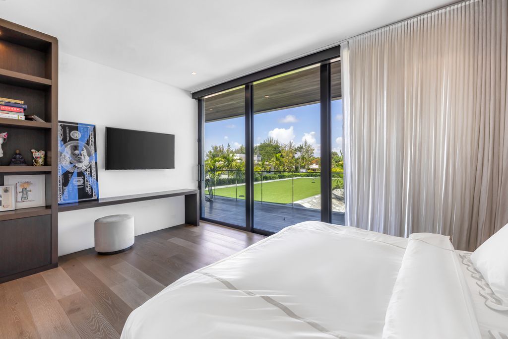 The Mansion in Miami Beach is a luxurious retreat-inspired custom built residence provides a zen ambiance with floating orchid gardens now available for sale. This home located at 4395 Pine Tree Dr, Miami Beach, Florida
