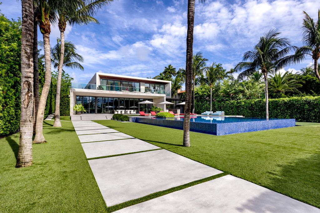 The Mansion in Miami Beach is a luxurious retreat-inspired custom built residence provides a zen ambiance with floating orchid gardens now available for sale. This home located at 4395 Pine Tree Dr, Miami Beach, Florida