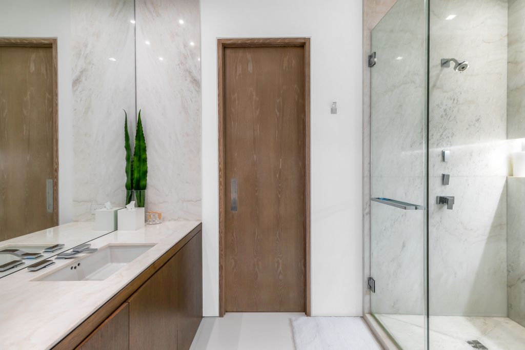 The Mansion in Miami Beach is a luxurious retreat-inspired custom built residence provides a zen ambiance with floating orchid gardens now available for sale. This home located at 4395 Pine Tree Dr, Miami Beach, Florida
