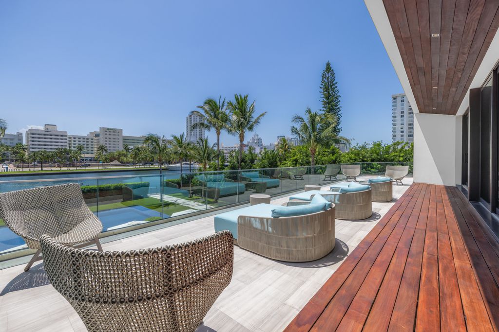 The Mansion in Miami Beach is a luxurious retreat-inspired custom built residence provides a zen ambiance with floating orchid gardens now available for sale. This home located at 4395 Pine Tree Dr, Miami Beach, Florida