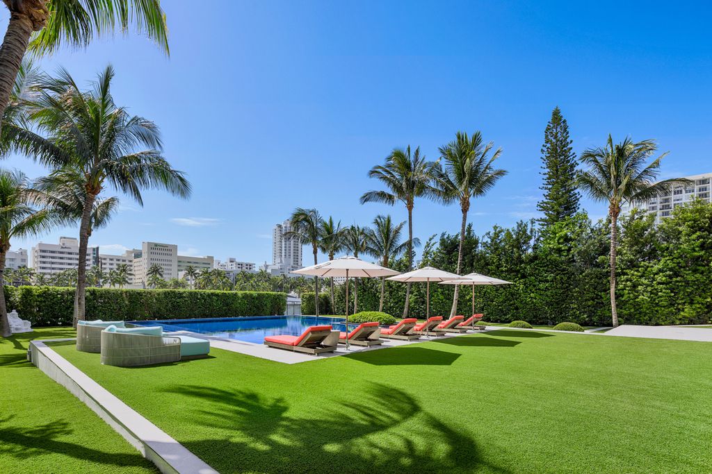 The Mansion in Miami Beach is a luxurious retreat-inspired custom built residence provides a zen ambiance with floating orchid gardens now available for sale. This home located at 4395 Pine Tree Dr, Miami Beach, Florida
