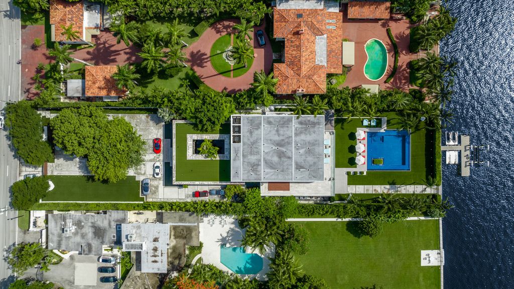 The Mansion in Miami Beach is a luxurious retreat-inspired custom built residence provides a zen ambiance with floating orchid gardens now available for sale. This home located at 4395 Pine Tree Dr, Miami Beach, Florida