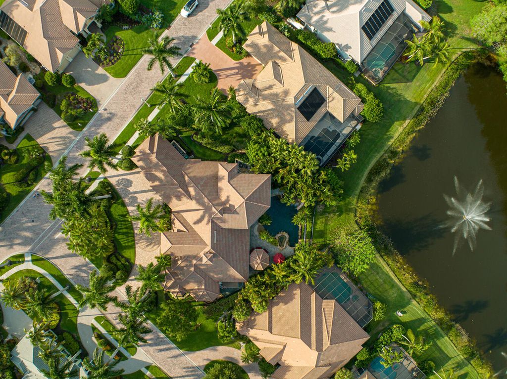 The Home in Naples is an exceptional custom home unlike any other in Watercrest with resort style outdoor area now available for sale. This home located at 2350 Cheshire Ln, Naples, Florida
