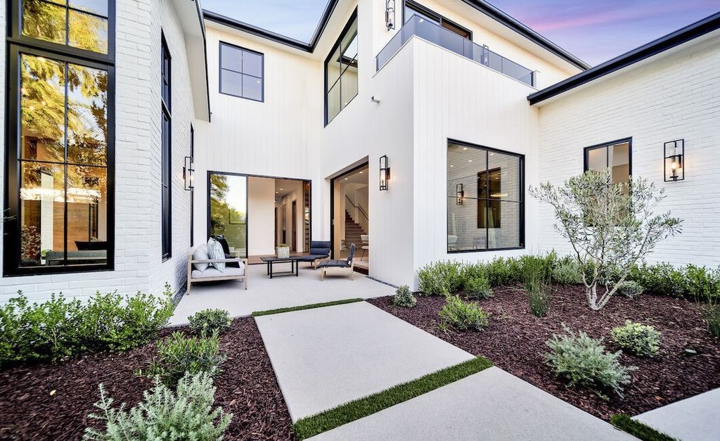 The Home in Encino is a masterfully crafted manor built with tasteful finishes and impeccable attention to detail now available for sale. This home located at 16739 Octavia Pl, Encino, California