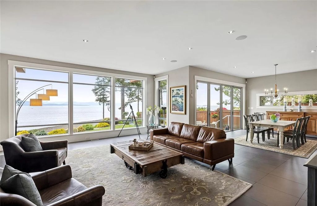 The Home in Parksville is majestically set on 0.64 of an acre with a private path that leads to the beach living space below, now available for sale. This home located at 798 Fairwind Ave, Parksville, BC V9P 1B2, Canada