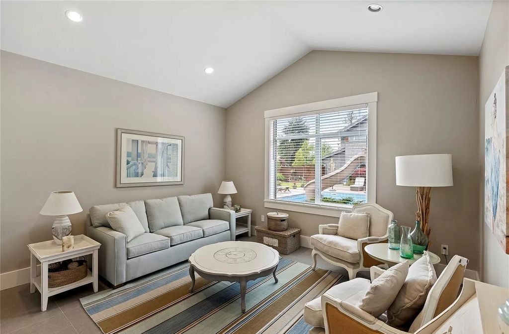 The Home in Parksville is majestically set on 0.64 of an acre with a private path that leads to the beach living space below, now available for sale. This home located at 798 Fairwind Ave, Parksville, BC V9P 1B2, Canada