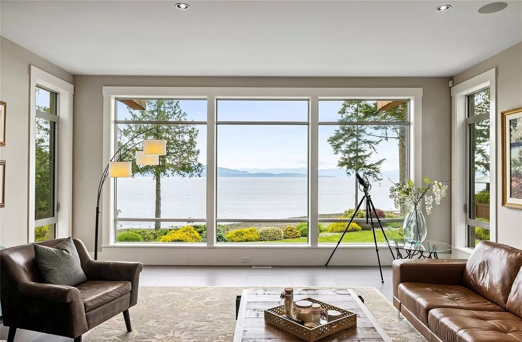 The Home in Parksville is majestically set on 0.64 of an acre with a private path that leads to the beach living space below, now available for sale. This home located at 798 Fairwind Ave, Parksville, BC V9P 1B2, Canada