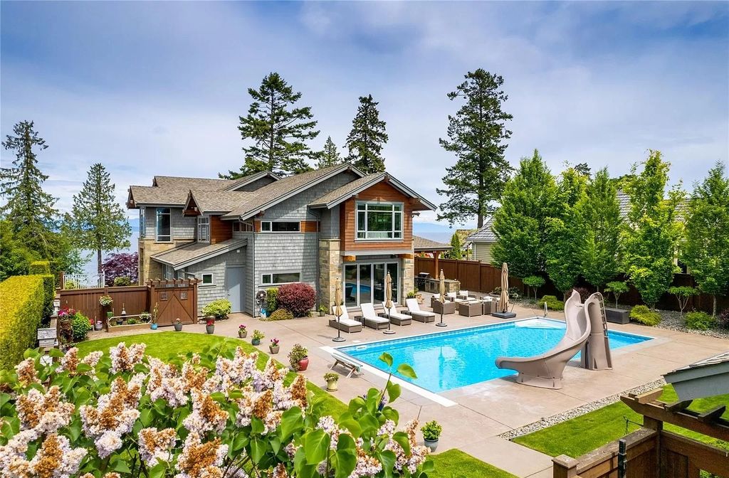 The Home in Parksville is majestically set on 0.64 of an acre with a private path that leads to the beach living space below, now available for sale. This home located at 798 Fairwind Ave, Parksville, BC V9P 1B2, Canada