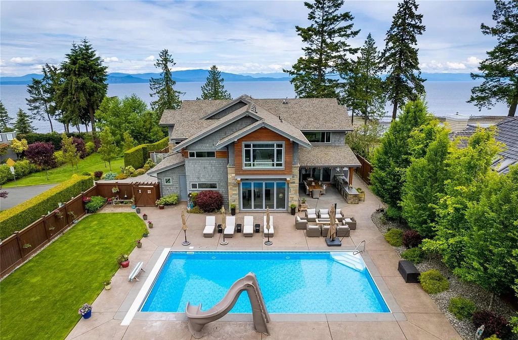 The Home in Parksville is majestically set on 0.64 of an acre with a private path that leads to the beach living space below, now available for sale. This home located at 798 Fairwind Ave, Parksville, BC V9P 1B2, Canada